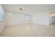 Bright and airy living room with tile flooring and multiple windows providing natural light at 25188 N 174Th Ave, Surprise, AZ 85387