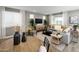 Bright living room with modern furnishings, neutral colors, and large windows for plenty of natural light at 25188 N 174Th Ave, Surprise, AZ 85387
