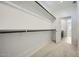 Spacious walk-in closet with shelving and an entrance to the bathroom at 25188 N 174Th Ave, Surprise, AZ 85387