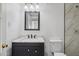 Bathroom features modern vanity with granite counters and updated fixtures at 2636 N Dayton St, Phoenix, AZ 85006