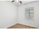 Bedroom with neutral carpet, ceiling fan, and large window for natural light at 2636 N Dayton St, Phoenix, AZ 85006