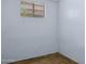 Simple bedroom with wood floors and a window at 2636 N Dayton St, Phoenix, AZ 85006