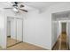 Minimal bedroom featuring a closet with mirrored doors, tile floors, and neutral walls at 2636 N Dayton St, Phoenix, AZ 85006