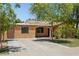 Charming single-story home with a covered porch, mature trees, and a driveway at 2636 N Dayton St, Phoenix, AZ 85006