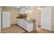 Compact kitchen featuring white appliances, cabinets, and functional countertops, offering a practical cooking space at 2636 N Dayton St, Phoenix, AZ 85006