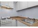 This kitchen features essential appliances and ample cabinet storage, maximizing the functionality of the space at 2636 N Dayton St, Phoenix, AZ 85006