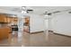 Spacious living area with ceiling fans, tile flooring, and an open layout to the kitchen at 2636 N Dayton St, Phoenix, AZ 85006