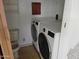 This laundry room features updated washing machines, offering convenience and efficiency at 2656 N 56Th St # C160, Mesa, AZ 85215