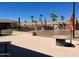 Outdoor kitchen and dining area with grill, bar, and patio, creating an inviting space for summer barbecues and gatherings at 2656 N 56Th St # C160, Mesa, AZ 85215