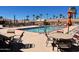 Sparkling swimming pool surrounded by lounge chairs and tables, providing a relaxing oasis for swimming, sunbathing, and recreation at 2656 N 56Th St # C160, Mesa, AZ 85215