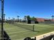 Well-maintained tennis court with net and green surface, ideal for enjoying a game of tennis in a beautiful setting at 2656 N 56Th St # C160, Mesa, AZ 85215