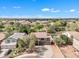 Aerial view of a beautiful suburban neighborhood with mature landscaping and a backyard pool at 308 E Sheffield Ct, Gilbert, AZ 85296