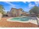 Inviting backyard featuring a sparkling pool and well-manicured landscaping at 308 E Sheffield Ct, Gilbert, AZ 85296