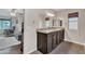 Bathroom boasting double sinks with granite countertops and wood-look flooring at 308 E Sheffield Ct, Gilbert, AZ 85296