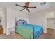Bedroom features a plush bed and a ceiling fan for comfort at 308 E Sheffield Ct, Gilbert, AZ 85296