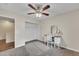 Bedroom with a ceiling fan and a vanity with a chair and mirror at 308 E Sheffield Ct, Gilbert, AZ 85296