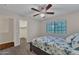Bedroom with a ceiling fan, carpeted floors, and a bed at 308 E Sheffield Ct, Gilbert, AZ 85296