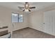 Bedroom with carpeted floors, a window, and a ceiling fan at 308 E Sheffield Ct, Gilbert, AZ 85296