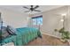 Bedroom featuring a ceiling fan and a large window allowing natural light to stream in at 308 E Sheffield Ct, Gilbert, AZ 85296