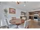Eat-in dining area with round table and chairs, adjacent to a kitchen with stainless steel appliances at 308 E Sheffield Ct, Gilbert, AZ 85296