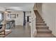 View of the entryway leading to living room and dining area with staircase at 308 E Sheffield Ct, Gilbert, AZ 85296
