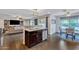 Open concept with kitchen island, adjacent dining area, and a seamless transition to the living space at 308 E Sheffield Ct, Gilbert, AZ 85296