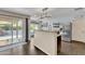 Bright kitchen featuring granite countertops, stainless steel refrigerator, and a view of the outdoor patio at 308 E Sheffield Ct, Gilbert, AZ 85296