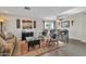Living room with ceiling fan, wood look floors, traditional furniture and decor, and plenty of light at 308 E Sheffield Ct, Gilbert, AZ 85296