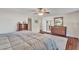 Spacious main bedroom featuring a ceiling fan, ensuite bathroom and dark wood furniture at 308 E Sheffield Ct, Gilbert, AZ 85296