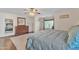 Spacious main bedroom showcasing wood floors, natural light, and a neutral color palette at 308 E Sheffield Ct, Gilbert, AZ 85296