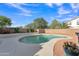 Backyard pool with surrounding landscaping and patio area at 308 E Sheffield Ct, Gilbert, AZ 85296