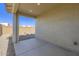 Covered back patio with concrete flooring and gravel landscaping at 3129 S 155Th Ln, Goodyear, AZ 85338