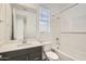 Bathroom featuring a tub, sleek vanity, and window at 3129 S 155Th Ln, Goodyear, AZ 85338