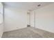 A well-lit bedroom featuring plush carpeting and neutral color scheme at 3129 S 155Th Ln, Goodyear, AZ 85338