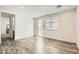 Light-filled bedroom with wood-look flooring and view to the backyard at 3129 S 155Th Ln, Goodyear, AZ 85338
