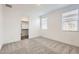 Bright bedroom showcasing a walk-in closet and light-filled windows at 3129 S 155Th Ln, Goodyear, AZ 85338