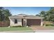 Charming home featuring a well-manicured lawn, a neutral color scheme, and a two-car garage at 3129 S 155Th Ln, Goodyear, AZ 85338