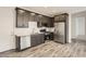 Kitchen area with stainless steel appliances and dark cabinetry at 3129 S 155Th Ln, Goodyear, AZ 85338