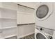 Stackable laundry machines with built in closet and shelves for storage at 3129 S 155Th Ln, Goodyear, AZ 85338