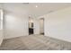 Spacious main bedroom with a view into the main bathroom and plush carpet flooring at 3129 S 155Th Ln, Goodyear, AZ 85338