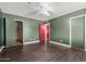 Bedroom showcasing wood-look vinyl flooring and a ceiling fan at 3226 W Grovers Ave, Phoenix, AZ 85053