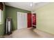 Cozy bedroom with closet, ceiling fan, and an open doorway, ready for personalization and comfort at 3226 W Grovers Ave, Phoenix, AZ 85053