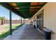 Spacious covered patio leading to a large backyard, perfect for outdoor entertaining and relaxation at 3226 W Grovers Ave, Phoenix, AZ 85053