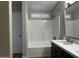 Bright bathroom featuring a shower-over-tub with white tiling and a modern vanity with stylish fixtures at 351 N Newport St, Chandler, AZ 85225