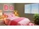 Charming bedroom with pink accents, soft lighting and a serene atmosphere at 351 N Newport St, Chandler, AZ 85225