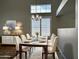Elegant dining room with stylish lighting fixture and seating for six at 351 N Newport St, Chandler, AZ 85225