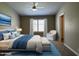 Comfortable main bedroom with serene colors and a large window at 351 N Newport St, Chandler, AZ 85225