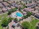 Aerial view of the community pool, showcasing lounge areas, sunshades and nearby playground at 3514 S Posse Trl, Gilbert, AZ 85297