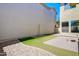 The backyard offers a low maintenance landscape with gravel and synthetic grass at 3514 S Posse Trl, Gilbert, AZ 85297