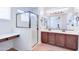 Bright bathroom features double sinks, a walk-in glass shower and a vanity area at 3514 S Posse Trl, Gilbert, AZ 85297
